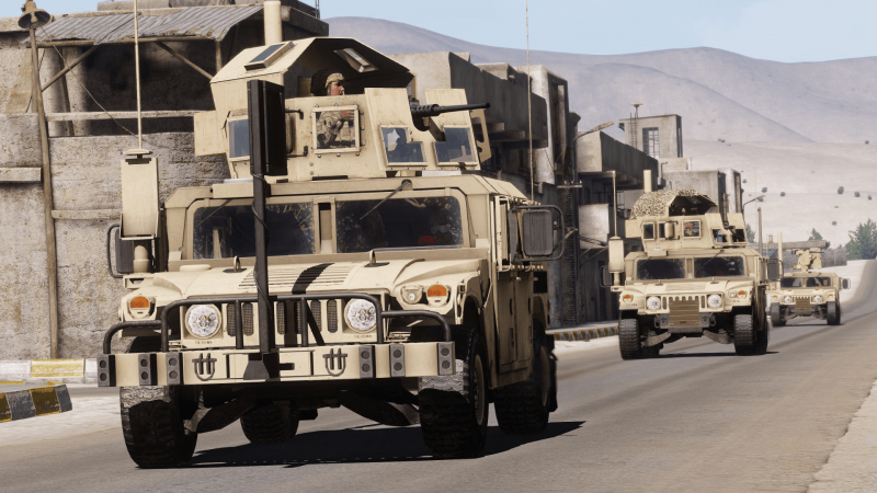 A column of US Army M1114 uparmored HMMWV (or Humvee)