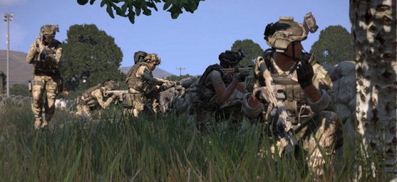 A fireteam takes cover at a low stone wall